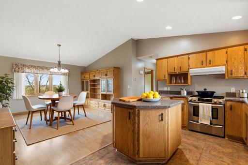 VIRTUALLY STAGED kitchen/dining space. There is NO STOVE in the property.