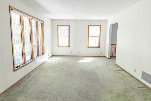 Sun-drenched Living Room just needs your choice of flooring