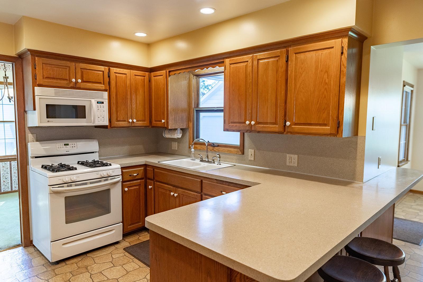 Kitchen features a Breakfast Area and plenty of countertop space & cabinetry