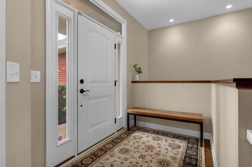 Welcoming foyer creates a warm first impression with inviting space to greet guests and comfortably transition into the heart of the home.