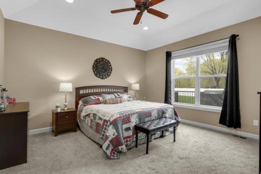 Spacious primary bedroom offering a peaceful retreat with generous closet space and natural light.