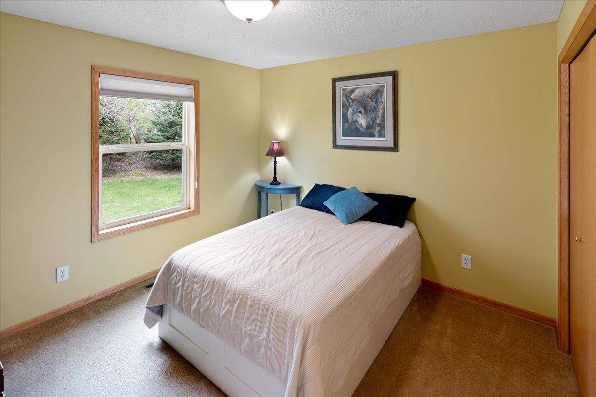 Bedroom #2 has a great view of the nature filled backyard