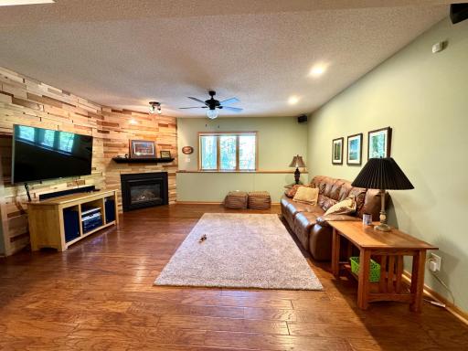 spacious LL family room with cozy gas fireplace