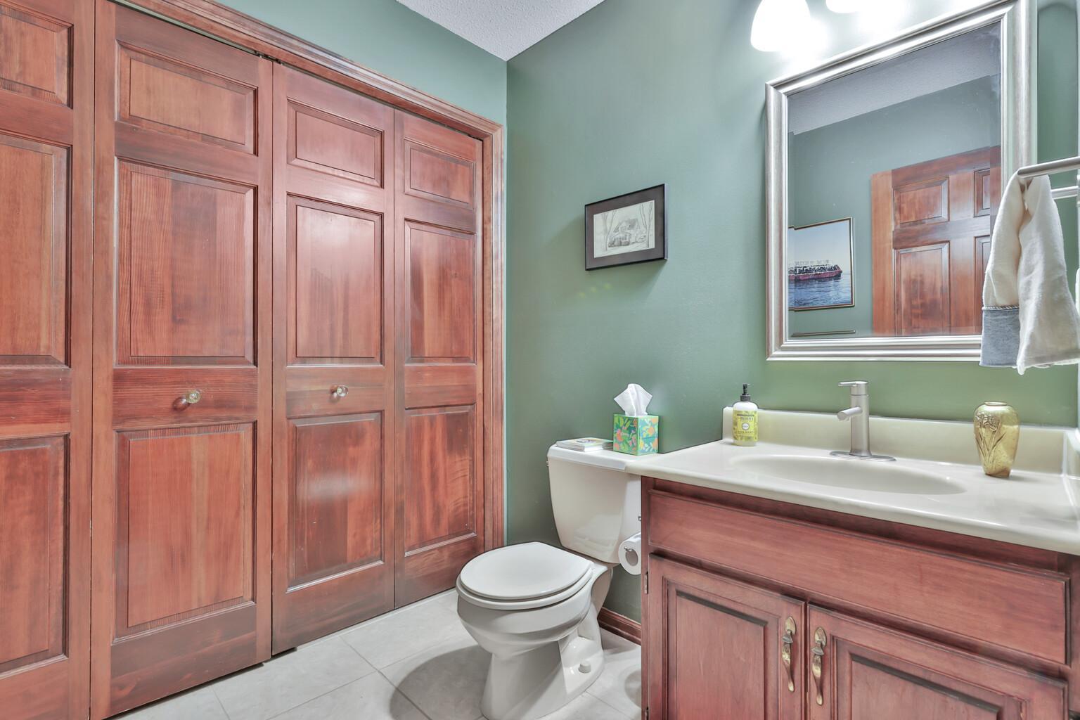 Main floor powder room / laundry room. Washer and dryer located behind these doors