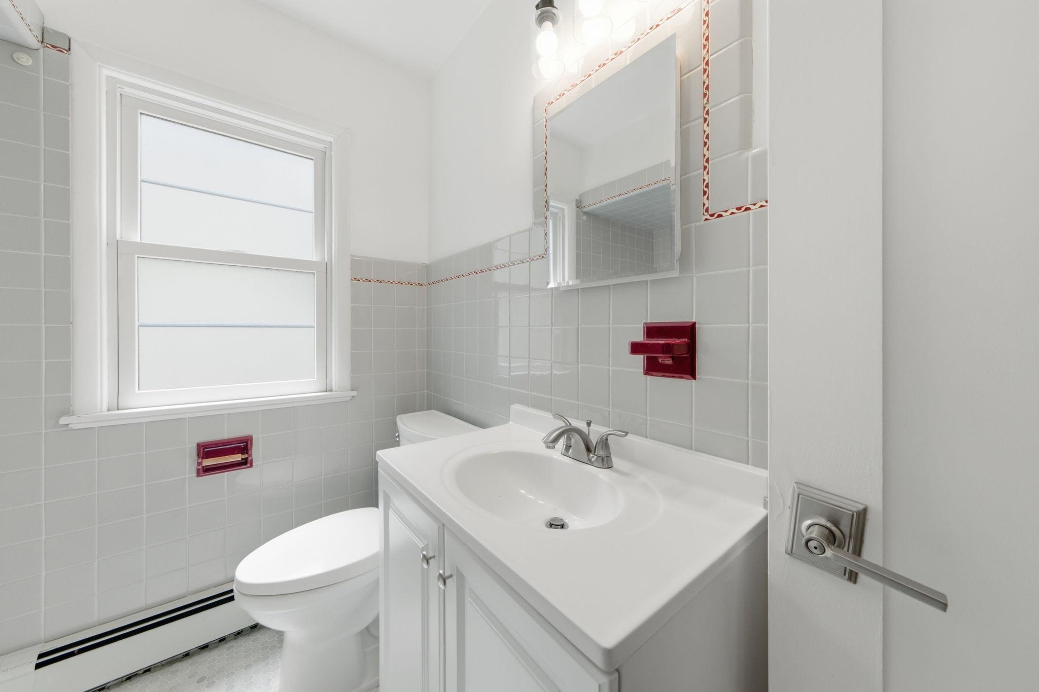 Main Floor full bath with original tilework