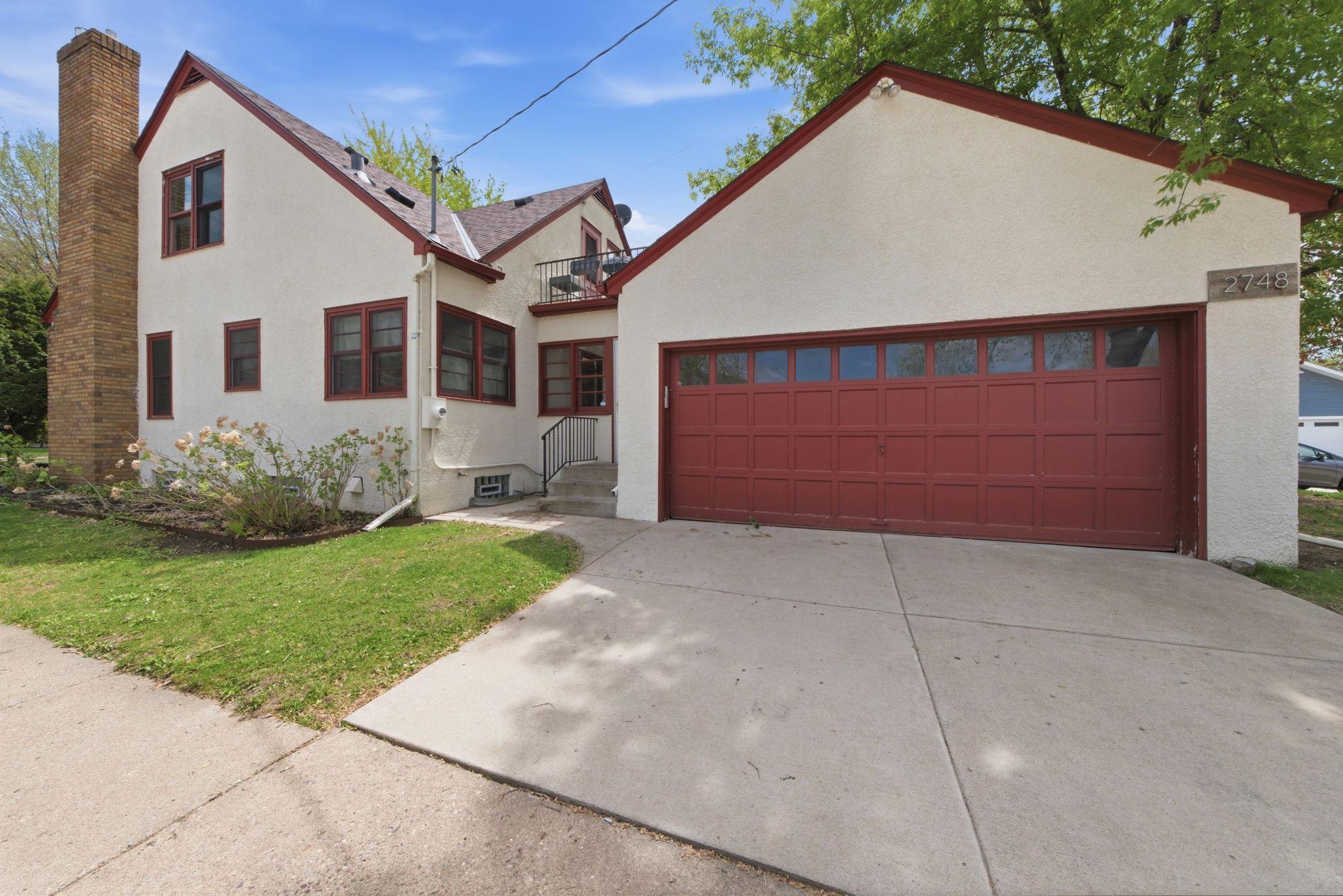 Side of home breezway entry and 2 car garage