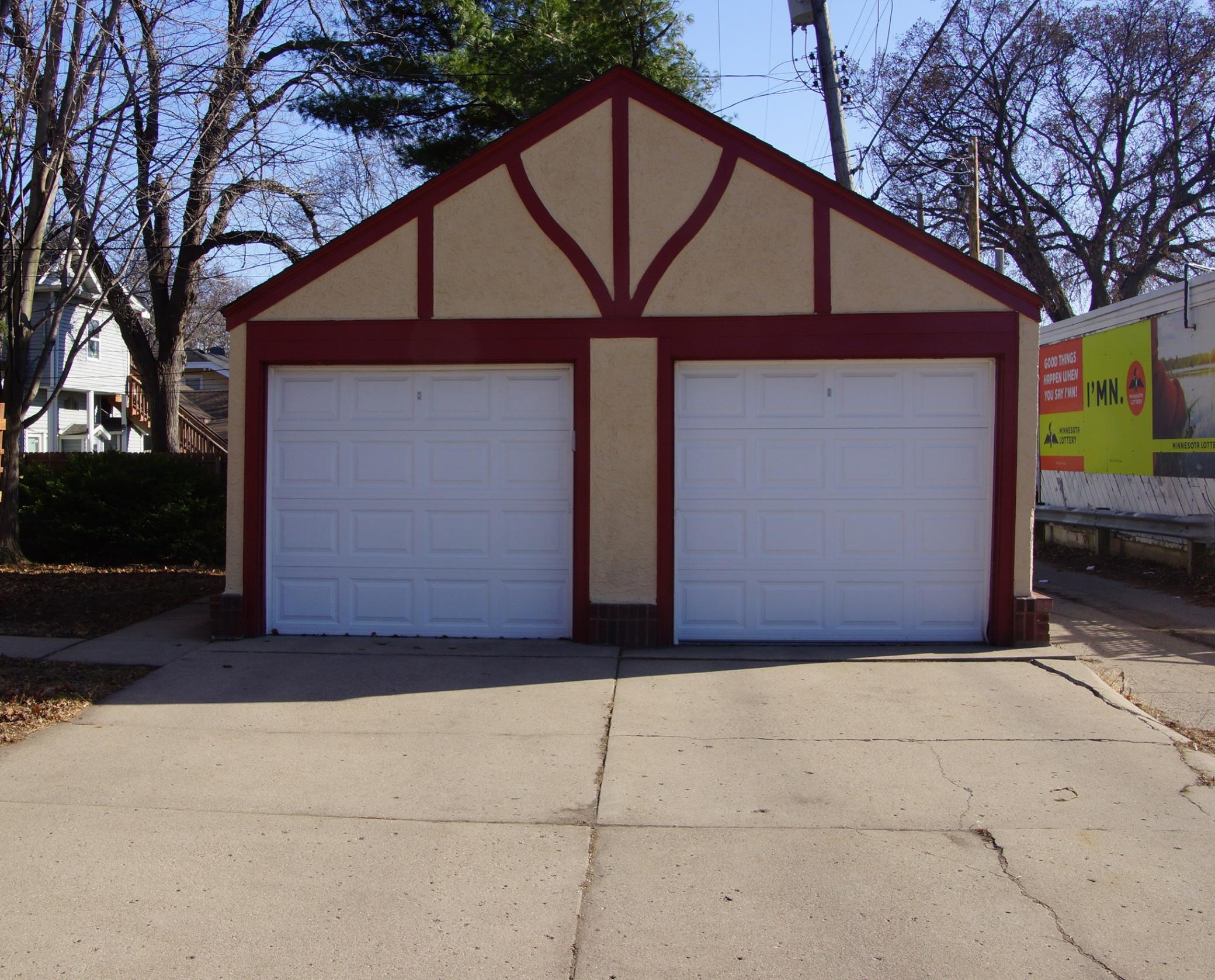 Garage and concrete driveway. Each unit gets 1 stall. Garage door opener on each door.