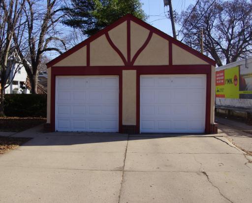 Garage and concrete driveway. Each unit gets 1 stall. Garage door opener on each door.