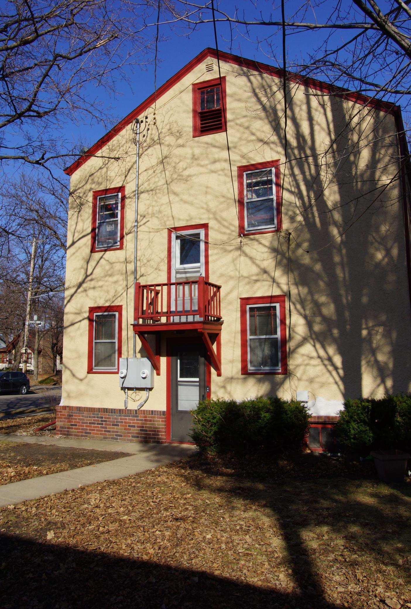 Classic Tudor Duplex. Back Entry leads to interior staircase and secure entry for both units. There is also access to the basement, storage rooms and laundry.