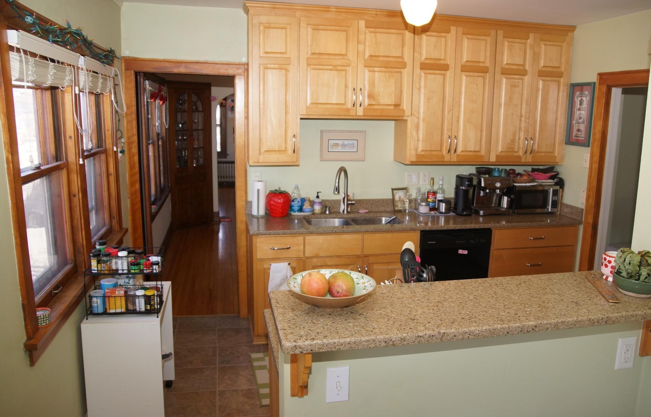 Updated Kitchen sports Maple Cabinetry and Quartz Counters!