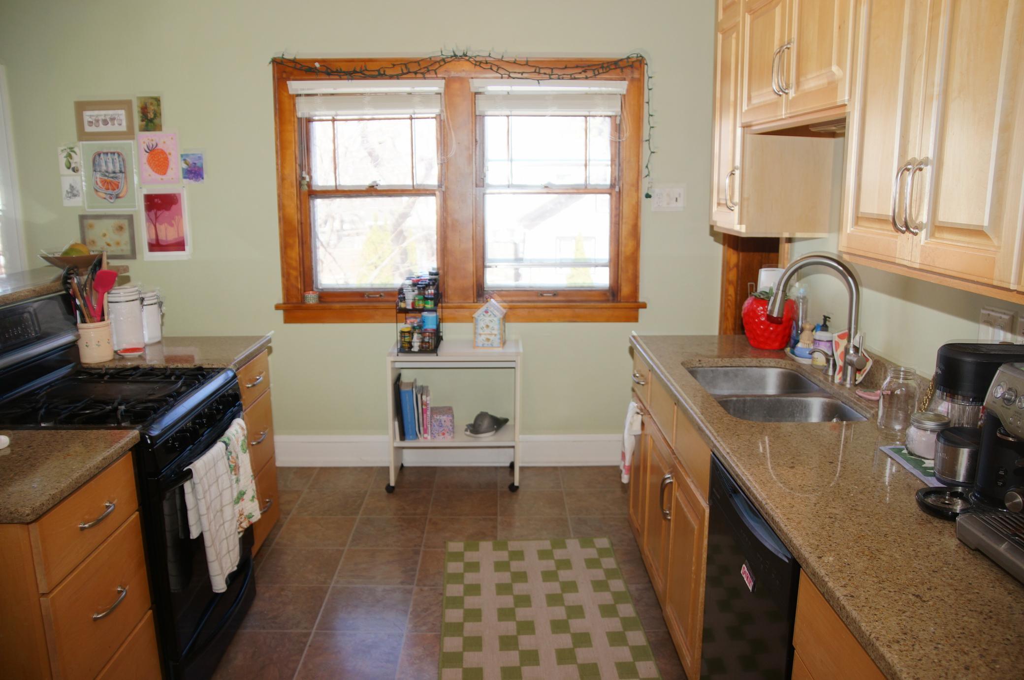 Updated Kitchen sports Maple Cabinetry and Quartz Counters!