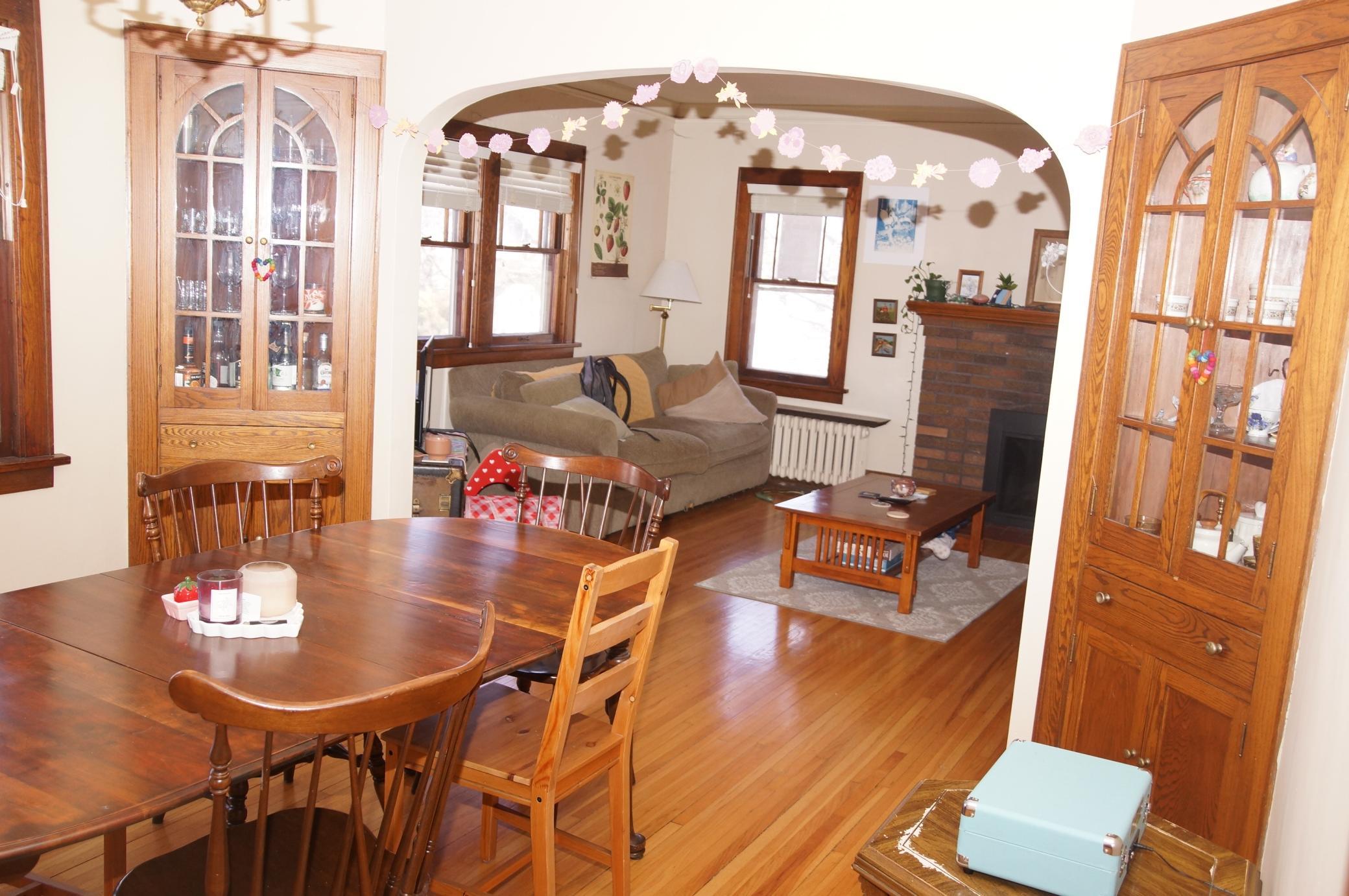 Dining Room with built-in Corner Hutches looking to Living Room