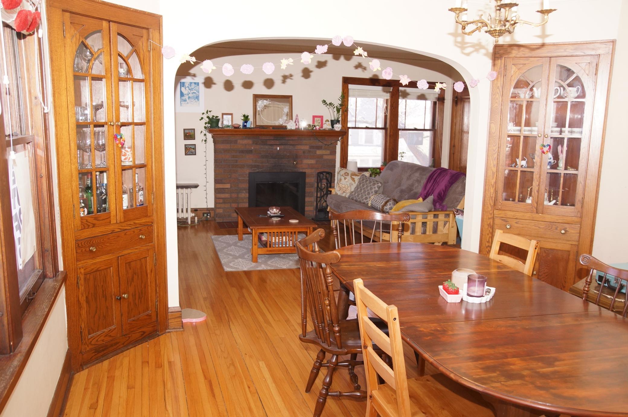 Dining Room with built-in Corner Hutches looking to Living Room