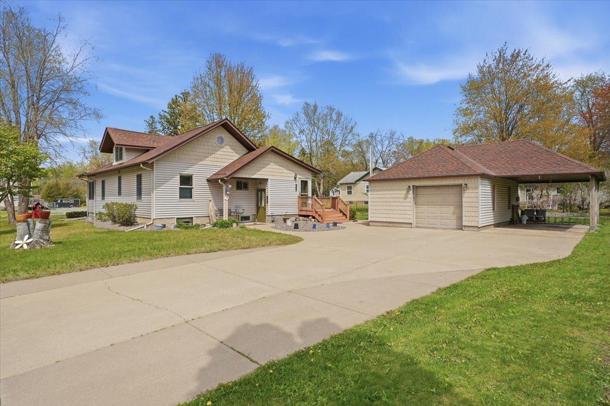 Concrete driveway, garage, and carport