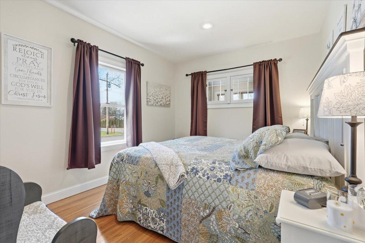Main floor bedroom. Little windows open to the front porch.