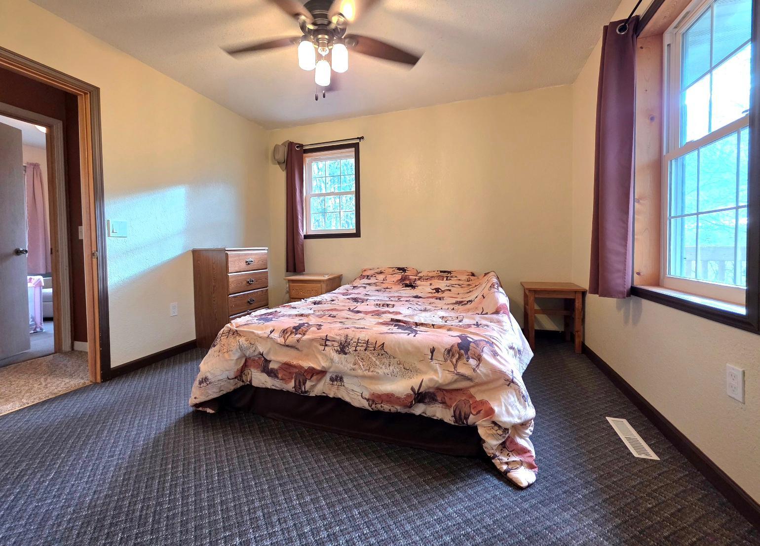 Primary bedroom with lots of natural light main level
