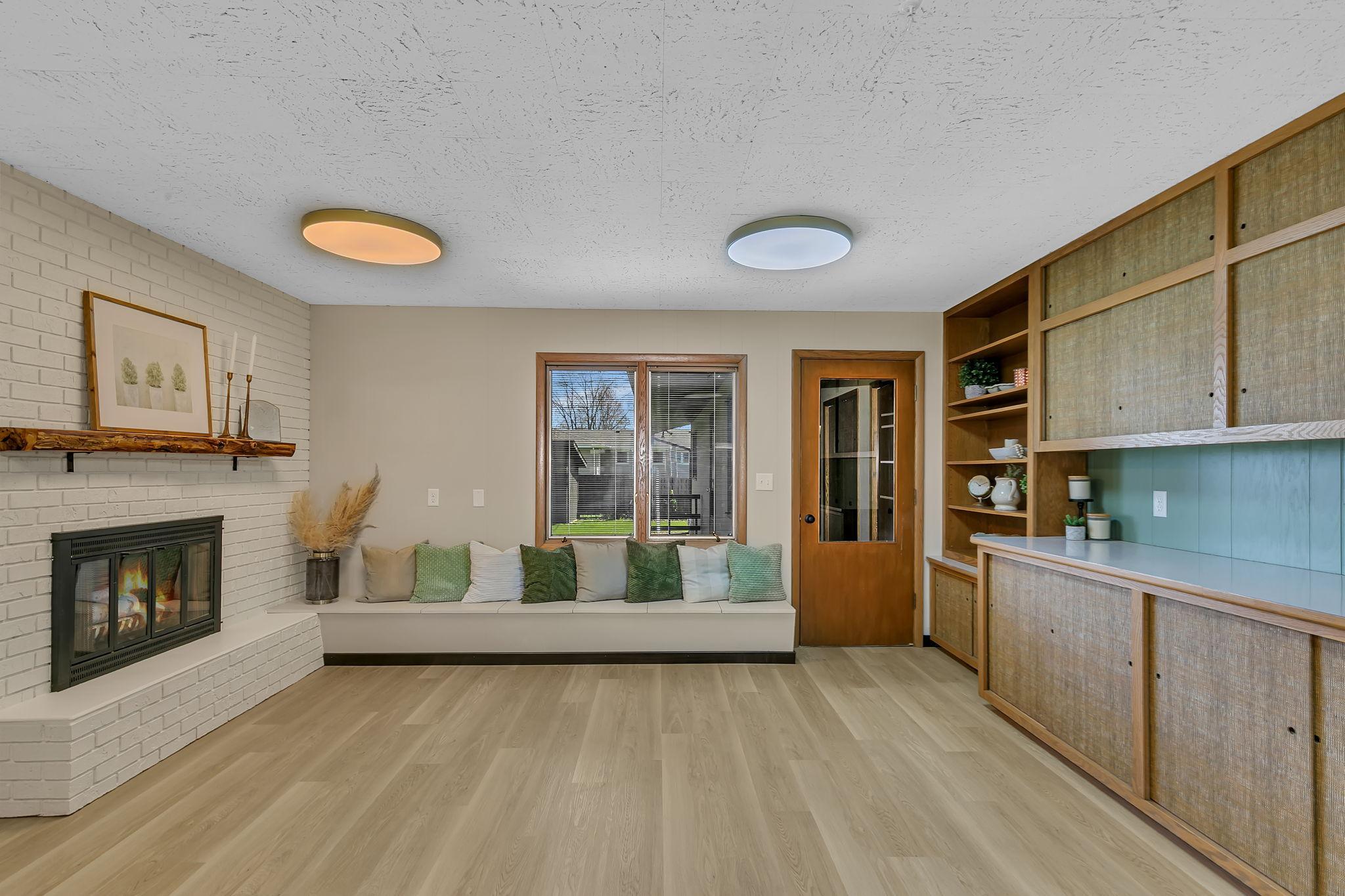Thoughtfully designed space offers endless possibilities. The two sided fireplace makes this a excellent dining room.