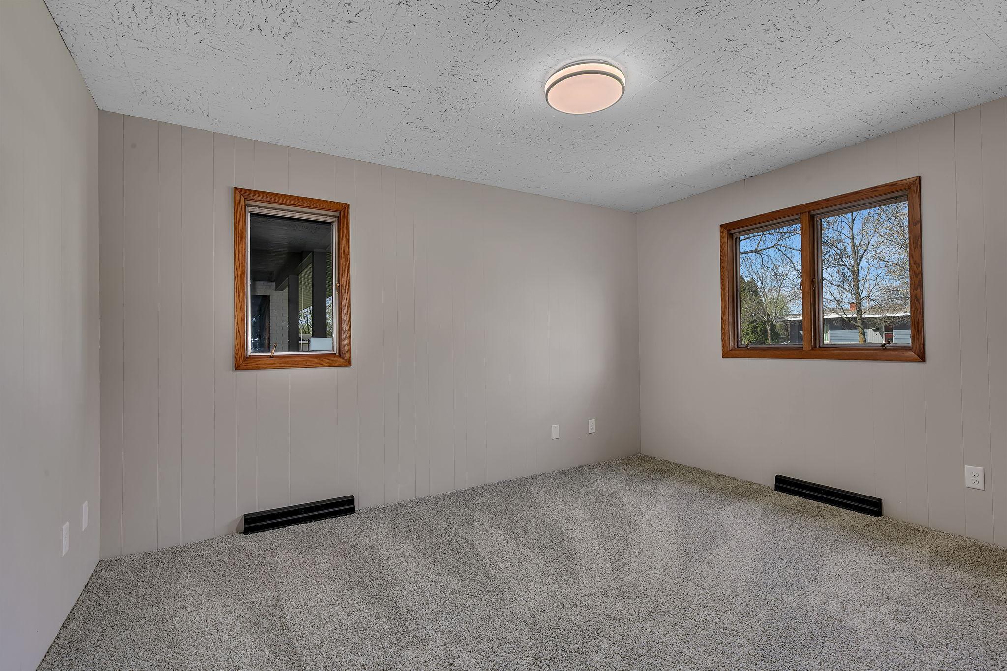 Well-sized bedroom ready for furnishing and personalization. This room has a vantage point to the front porch and front yard.