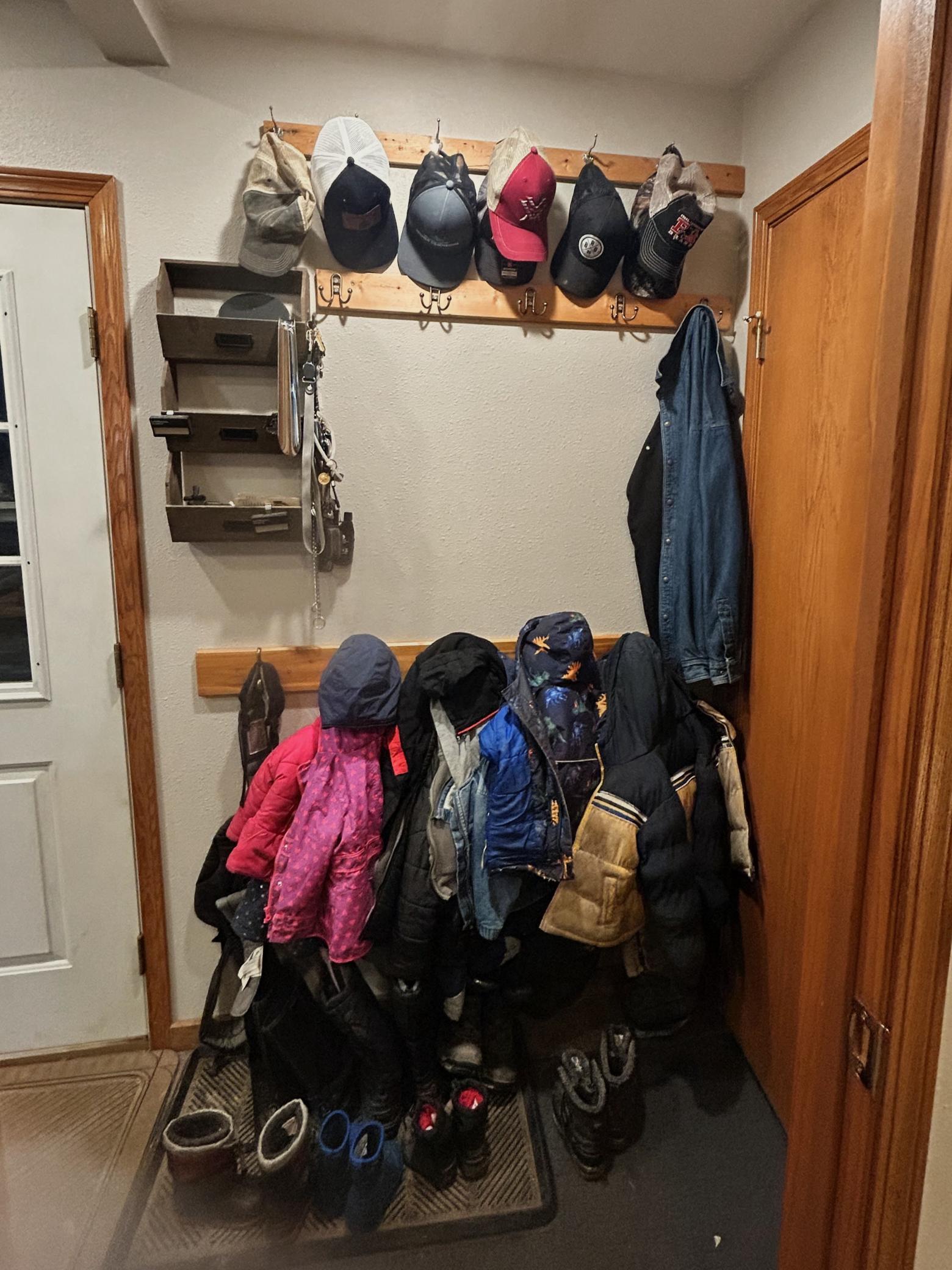 Front entryway, coat hooks and coat closet