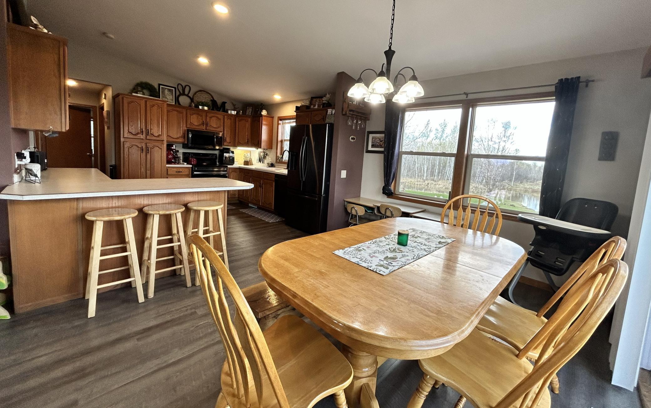 Great size dining room, breakfast bar at the counter, and patio doors to the deck!