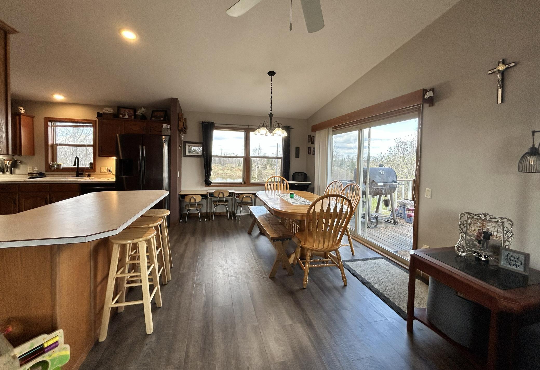 Great size dining room, breakfast bar at the counter, and patio doors to the deck!