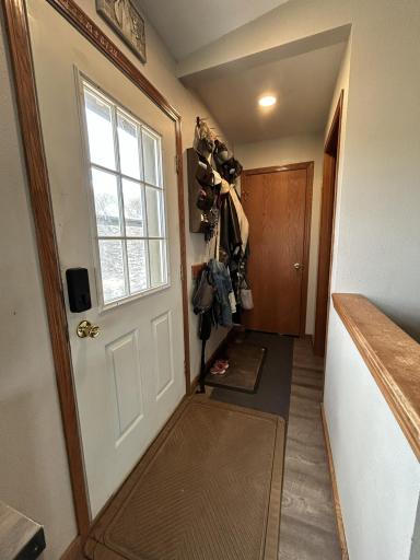 Front entryway, coat hooks and coat closet