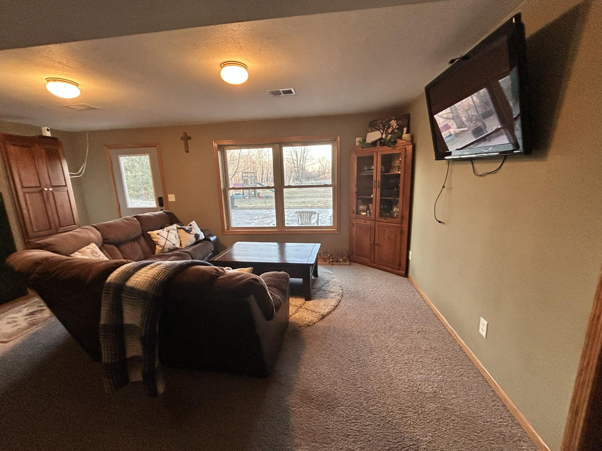 Lower level has 2 family rooms, with a walkout door to a large concrete patio for entertaining and hanging out