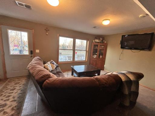 Lower level has 2 family rooms, with a walkout door to a large concrete patio for entertaining and hanging out