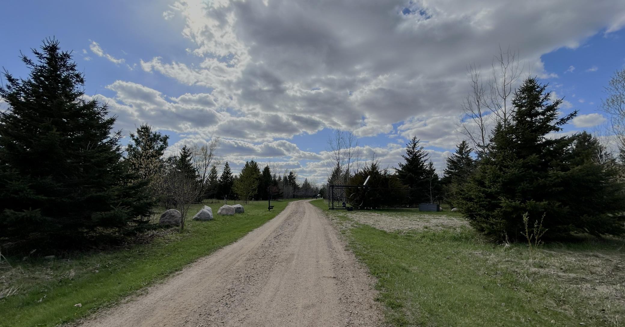 Private drive and trees provide a peaceful zone around the home