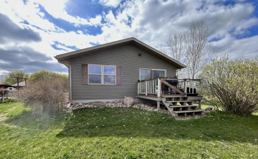 Deck off the dining room, with great view of the pond in the backyard and gardens to the east