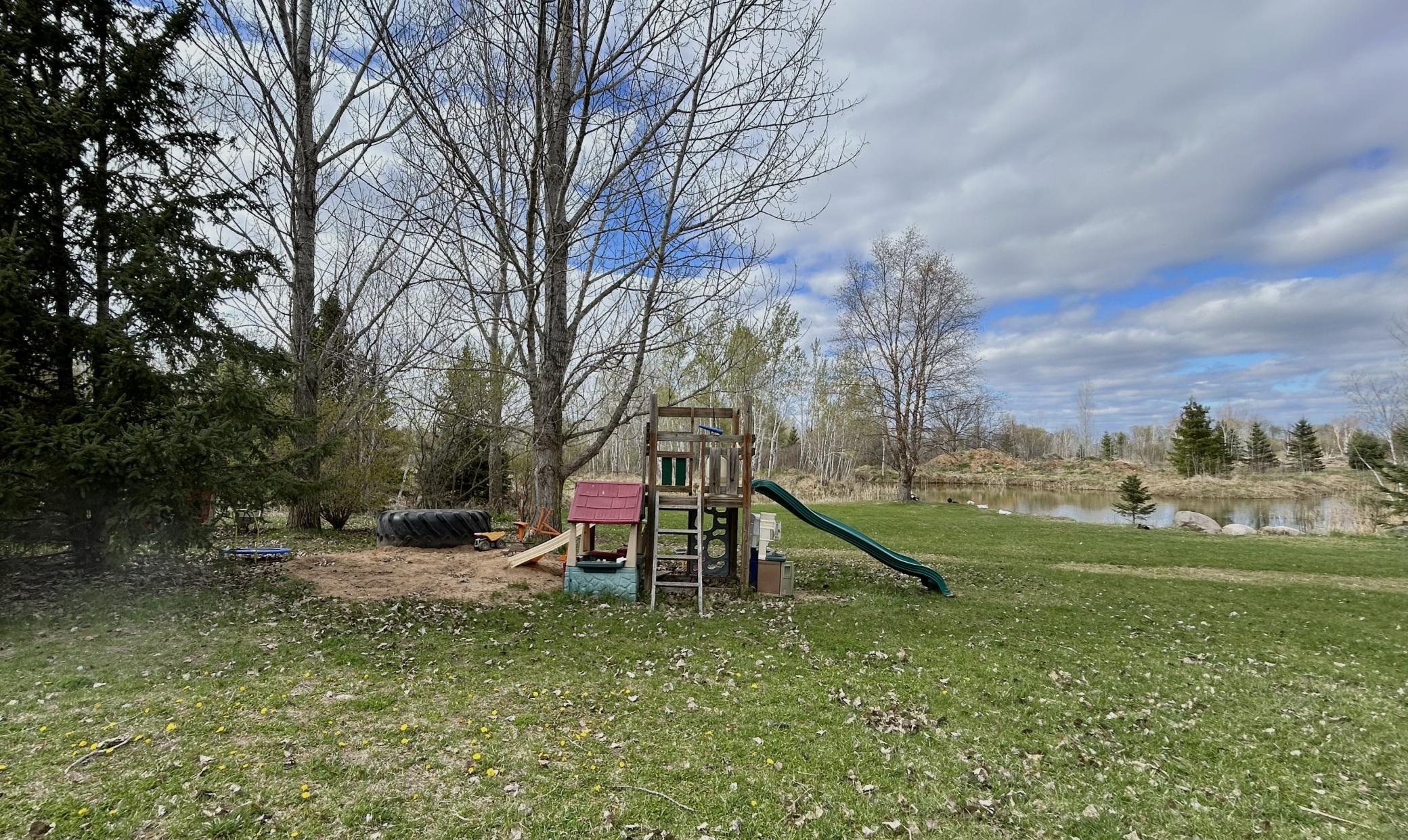 Flat backyard is great for playing, relaxing, and stretching out