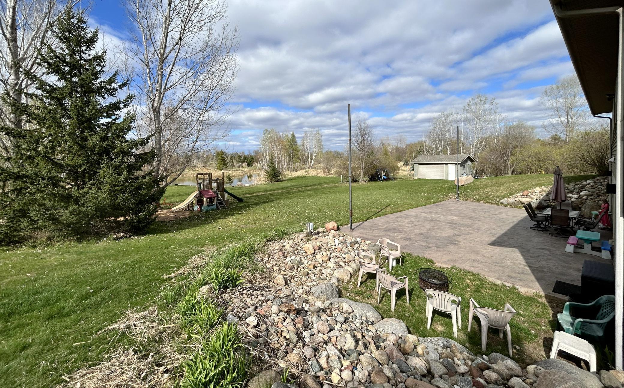 Flat backyard is great for playing, relaxing, and stretching out