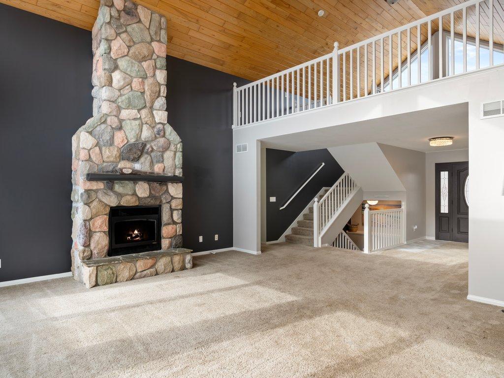 Beautiful Floor to Ceiling Stone Fireplace on Main Level Living Room.jpg