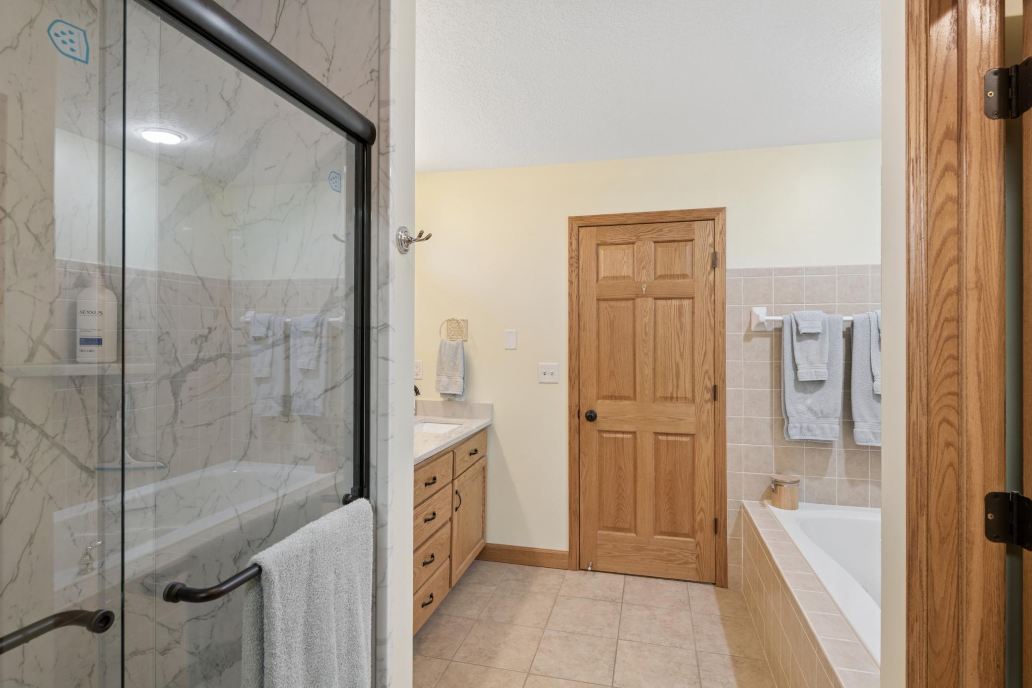 Primary bathroom - newly remodeled spa-style shower featuring a rain head fixture!