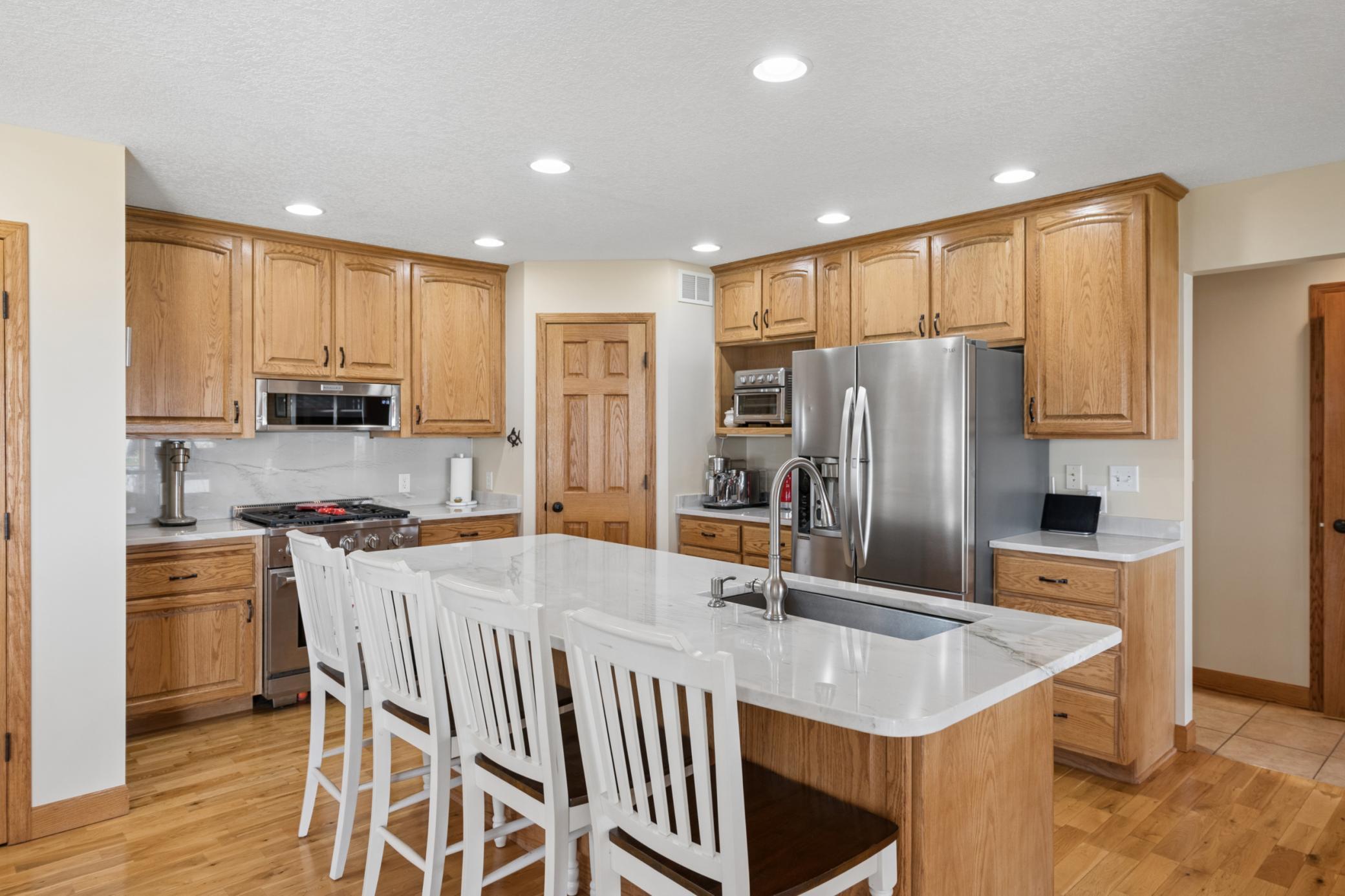 This kitchen creates a sophisticated look, yet it is a functional area centrally located and open to the first level for conversation.
