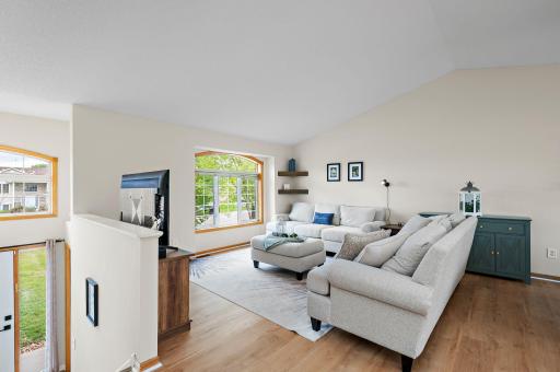 Living Room with open floor plan with dramatic vaulted ceilings!