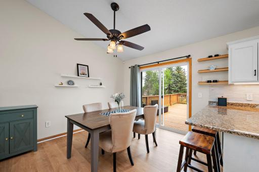 Step through the sliding glass doors off the dining area onto your nice deck, featuring stairs that lead down to a fully fenced, private backyard—complete with a gate that opens directly to a peaceful walking path