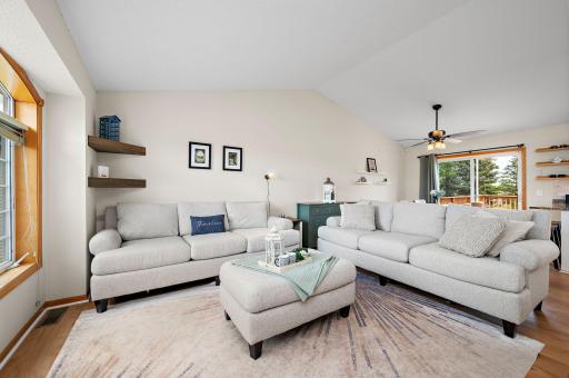 Living Room with open floor plan with dramatic vaulted ceilings!