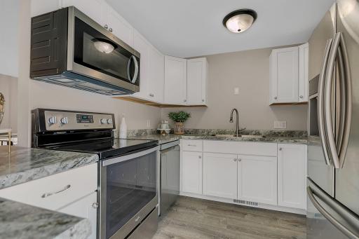 Stainless steel appliances throughout the kitchen.