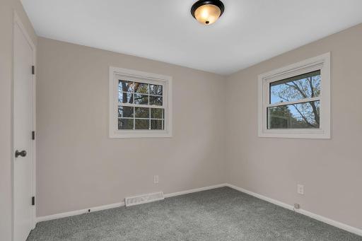 Additional upper level bedroom, ready for your personal touch.