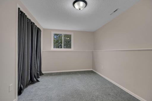 Lower level bedroom with great lighting.