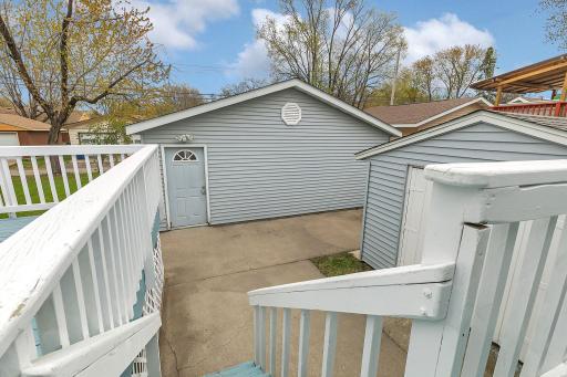 Patio space walks down to the detached garage.
