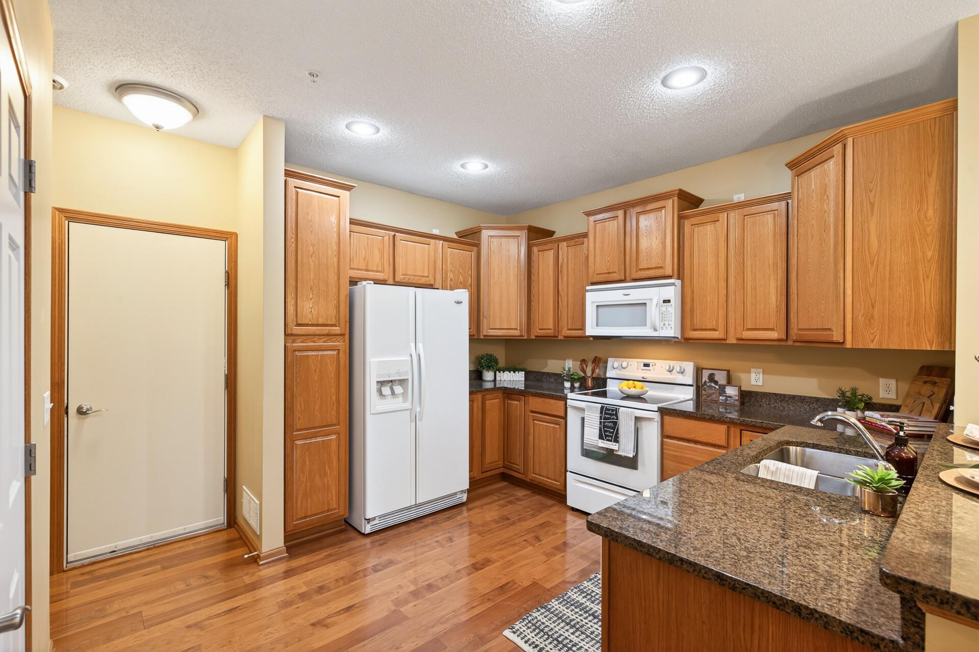 Granite countertops and ample cabinets