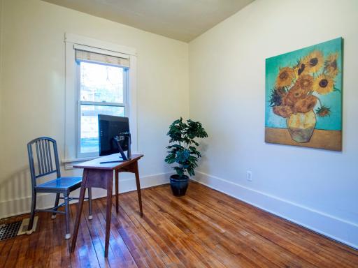 The main level features one of 3 bedrooms; here, it's staged as an office.