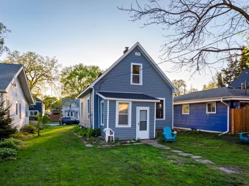 The back of the house includes a 3-season porch. The yard offers an inviting space for engaging in a multitude of activities.