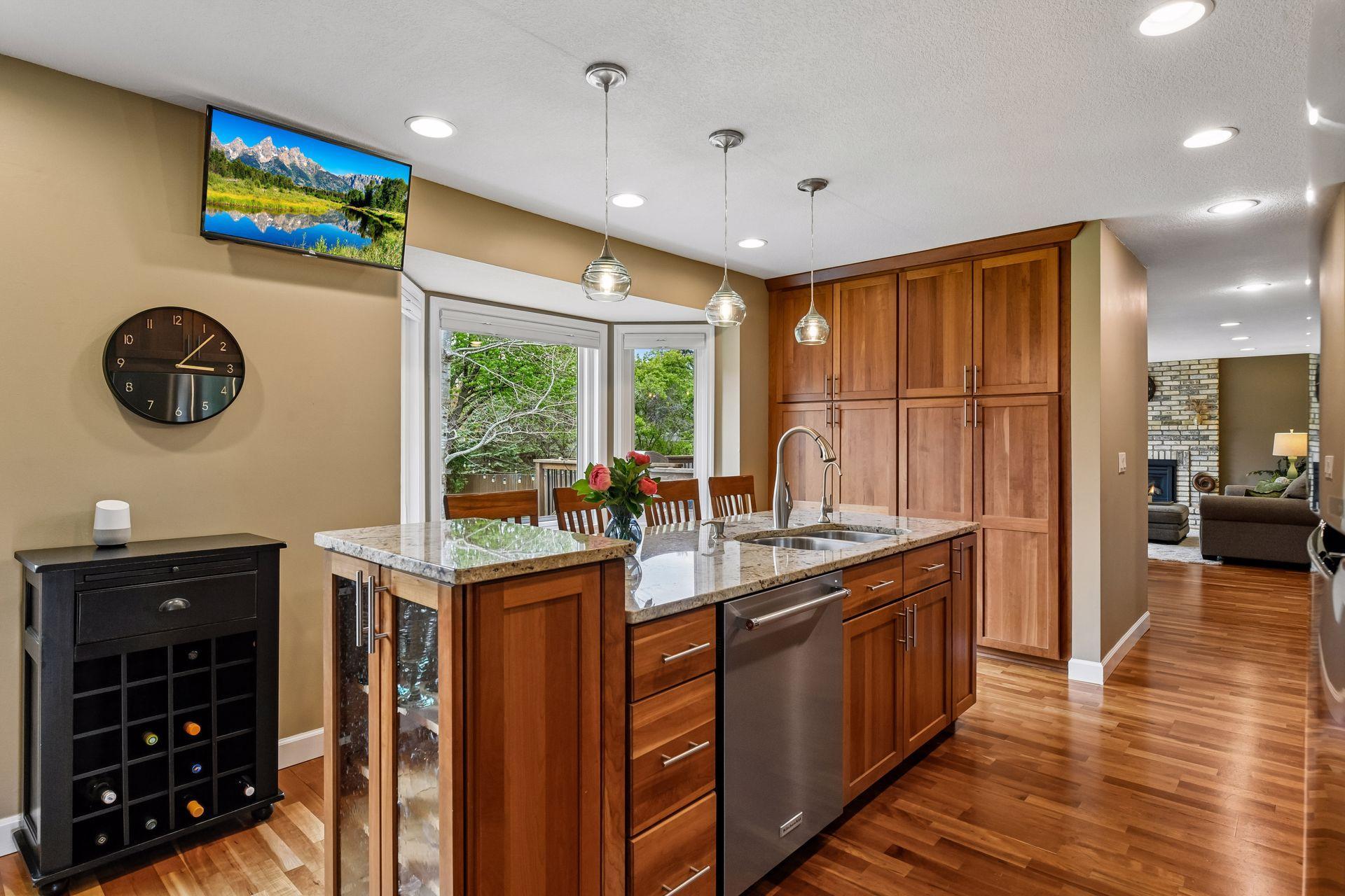 Bayed window enhances the space, bringing in natural light and offering views of the lush backyard.