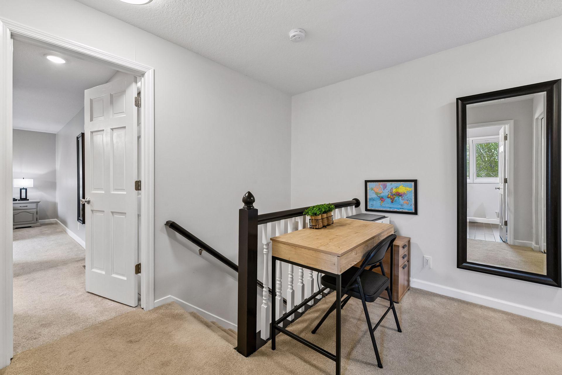 Upper level landing allows space for an office area.