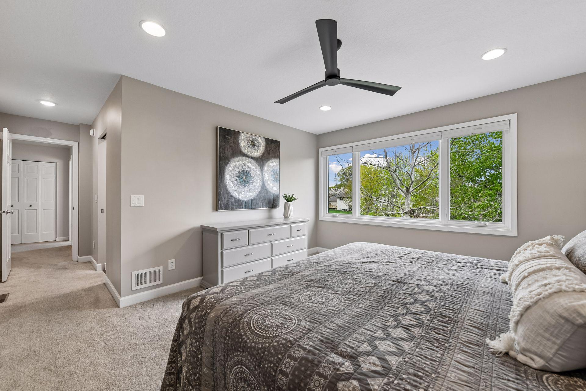Primary bedroom features dual closets with organizers.
