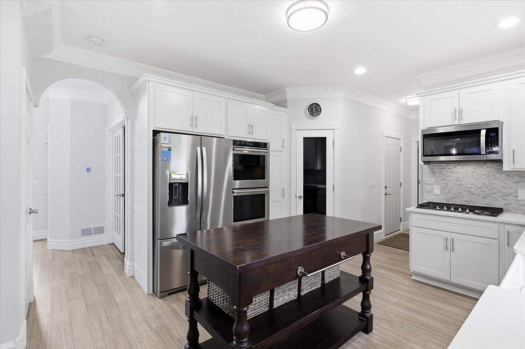 Chef's kitchen with high end stainless steel appliances, double ovens pantry, proofing oven