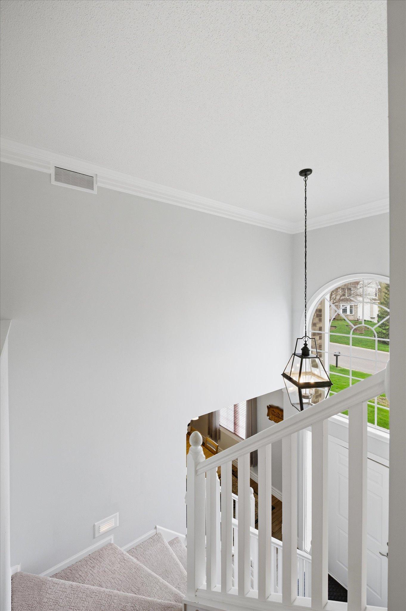 Two story entry with a beautiful picture window